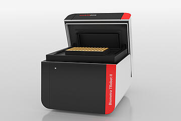 T-robot II thermal cycler with open lid, showing a 96-well heating block